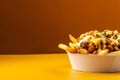 Poutine tasty fast food street food for take away on yellow background