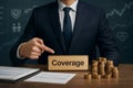 AI generated image of a professional businessman in a suit pointing at a nameplate reading Coverage with financial documents coins Royalty Free Stock Photo