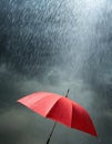 Red umbrella in heavy rain