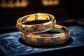 Sacrament: Matrimony. Wedding rings on a blue background. Shallow depth of field.