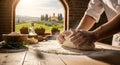 A person making bread dough in a rustic kitchen with a scenic vi Royalty Free Stock Photo