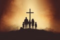 Silhouette of a Christian family standing in front of the cross Royalty Free Stock Photo