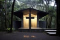 Wooden christian chapel and cross in the forest