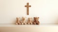 Wooden teddy bear family and christian cross on white wall background Royalty Free Stock Photo