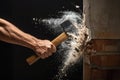 a worker hitting the wall with a sledgehammer Royalty Free Stock Photo