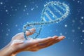 Mesmerizing blue DNA helix floating above a hand with a particle filled background, representing the fusion of science and tech