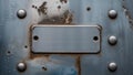 Metal surface with blank plate and rivets for labeling Royalty Free Stock Photo