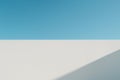 Sunlit White Wall Plane with Diagonal Shadow and Clear Blue Sky Royalty Free Stock Photo