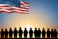 an american flag with silhouette of us army is standing in front of a sun Royalty Free Stock Photo