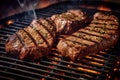 Grilled steaks on grill with herbs