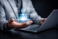 AI generated professional using laptop with holographic user profile checkmark interface representing identity verification access Royalty Free Stock Photo