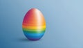 rainbow painted easter egg on calm blue background