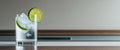 Refreshing gin and tonic with lime on a polished bar - sophisticated relaxation Royalty Free Stock Photo