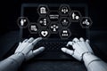 AI generated robotic hands using laptop with digital HR icons showing employee benefits payroll performance and workforce Royalty Free Stock Photo
