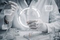 AI generated scientist with gloves using pipette to drop chemical into test tubes with holographic interface and molecular Royalty Free Stock Photo