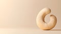 AI-generated Single Cashew Nut on Beige Background Royalty Free Stock Photo