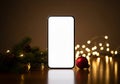AI generated. Smartphone Mockup with Blank Screen and Festive Christmas Decorations Royalty Free Stock Photo
