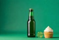 st patrick\'s day cupcake and beer on green background Royalty Free Stock Photo