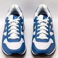 AI Generated Stylish White and Blue Sports Sneakers â Front Angle View Royalty Free Stock Photo