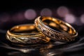 Wedding rings on a table with a bokeh background Royalty Free Stock Photo