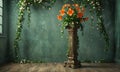 A tall vase with orange flowers in it is placed in the middle of a room. Royalty Free Stock Photo