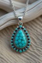 Beautiful turquoise pendant on a silver chain Royalty Free Stock Photo