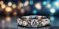 A tight shot of a ring featuring a clear diamond at its center, surrounded by indistinctive background lights. Royalty Free Stock Photo