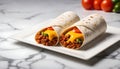 two burritos with cheese and vegetables on a white plate Royalty Free Stock Photo