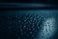 AI generated ultra realistic close up of water droplets on a smooth surface with soft blue reflections creating a calm quiet and Royalty Free Stock Photo