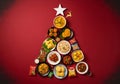 AI generated. Indian Christmas Feast Tree on Red Background Royalty Free Stock Photo
