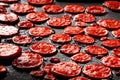 AI-generated view of pepperonis on a black surface Royalty Free Stock Photo