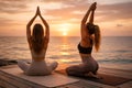 Outdoor Sunset Yoga Practice With Two Women On Wooden Platform By The Sea Royalty Free Stock Photo