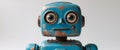 Whimsical Blue Rusty Robot Toy with Large Eyes and Distressed Finish