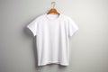 AI generated white men\'s t-shirt mockup template hanging on a hanger on a light neutral background. Royalty Free Stock Photo