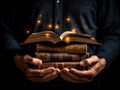 Ai generation. Man opened a magic book with growing lights and magic powder. Christmas reading concept. Royalty Free Stock Photo