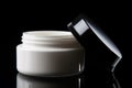 Ai Generative Cosmetic cream jar on a black background. Beauty and skin care concept