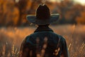 ai generative cowboy on the grassland back view Royalty Free Stock Photo