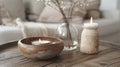 Elegant home ambiance with candle and delicate white flowers. Royalty Free Stock Photo