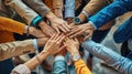 Group of diverse people joining hands in a circle.