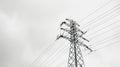 High-voltage power line tower against a cloudy sky. Royalty Free Stock Photo