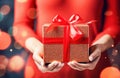 Ai generative. Christmas gift box with red ribbons in female hands Royalty Free Stock Photo