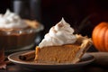 pumpkin pie with a dollop of whipped cream