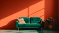 Modern empty room with colorful orange wall, window shadow and vintage green sofa. Studio shot with copy space. Royalty Free Stock Photo