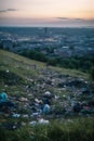 AI generative panoramic image of big city suburbs covered with piles of garbage