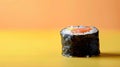 Single sushi roll on a dual-toned background. Royalty Free Stock Photo