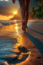 Sunset beach walk with silhouette of legs and tropical background. Royalty Free Stock Photo