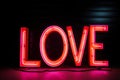 AI illustration of illuminated 'Love' lettering in bright pink lighting at night.