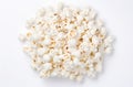 AI illustration of a pile of white popcorn kernels on a white background.