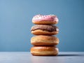 AI illustration of a stack of fresh doughnuts with colourful glazing and sprinkle decorations.