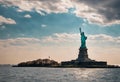 An AI illustration of the statue of liberty looks over the water as a boat sails past